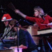 Jeanne Anne lunging for the cymbal. The band says this is payback for all of Rob’s wrong notes. I have tried several times in years past to catch this shot. Though it's blurry, Betty caught it.  (photo by Betty Horn)