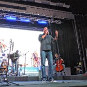 Andrew Fitzgibbon (Adult Discipleship / Group Life at West Side CC), the emcee for the evening, announces the offering.   (photo by Danl Blackwood)
