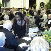 Monique Pittman, Spirit Productions LLC, visits with Asner after his acceptance.