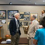 Jim Naismith (grandson of Dr. James Naismith) and Bill Worley (Naismith re-enactor), with statue of Dr. James Naismith in the background by Topeka artist Melissa Rau.